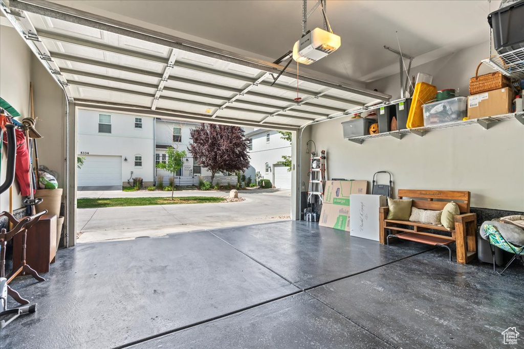 Garage featuring a garage door opener