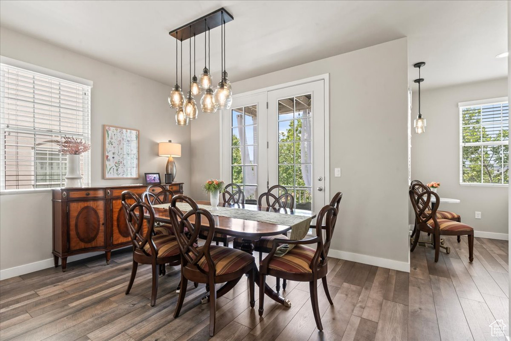Dining room featuring hardwood / wood-style floors and a chandelier