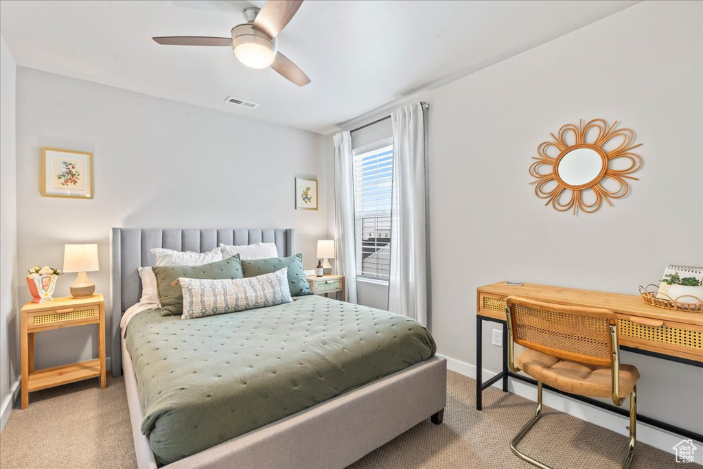 Bedroom with carpet flooring and a ceiling fan