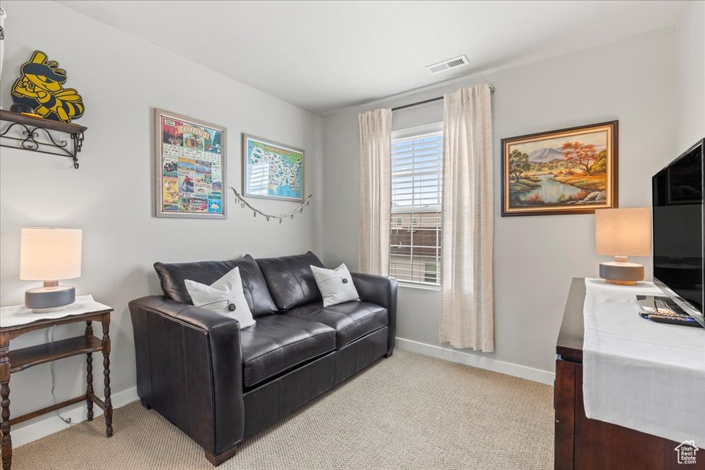Office space featuring light colored carpet