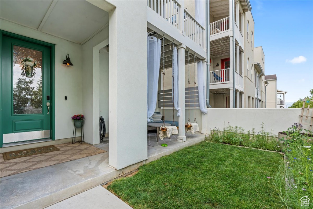 Property entrance with stucco siding