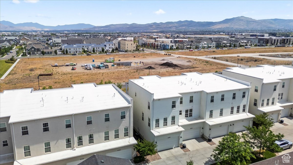 Aerial view of residential area featuring mountains