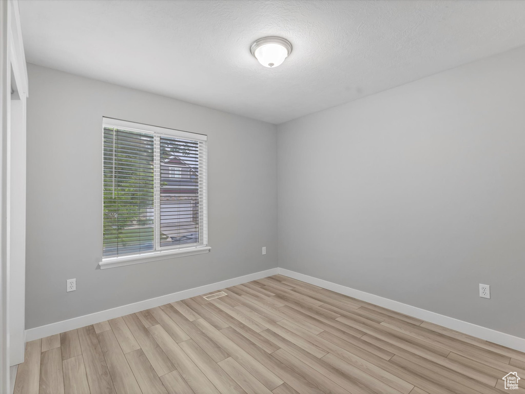 Spare room with light wood-style floors