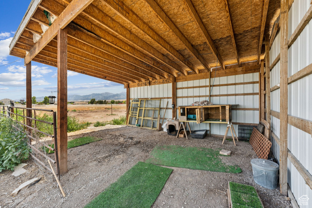 View of yard with a mountain view and an outbuilding