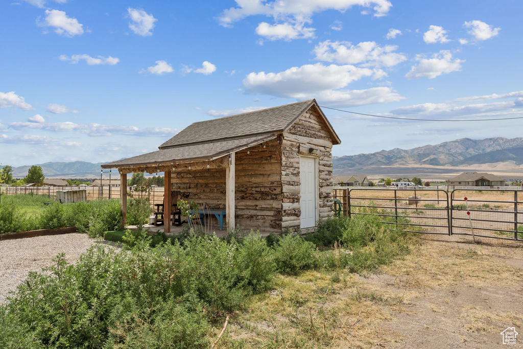 View of outbuilding featuring a mountain view