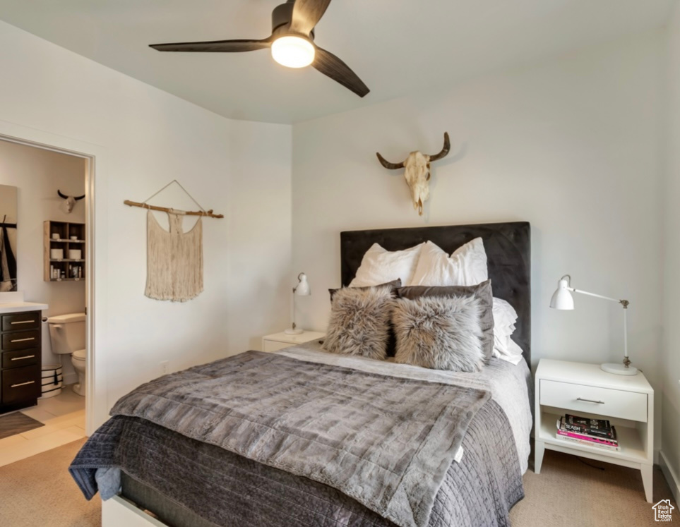 Bedroom featuring light carpet and a ceiling fan