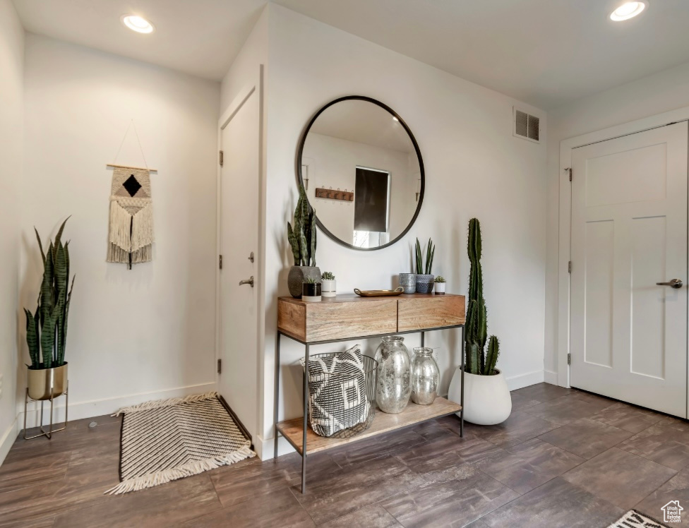 Foyer with recessed lighting and wood finished floors