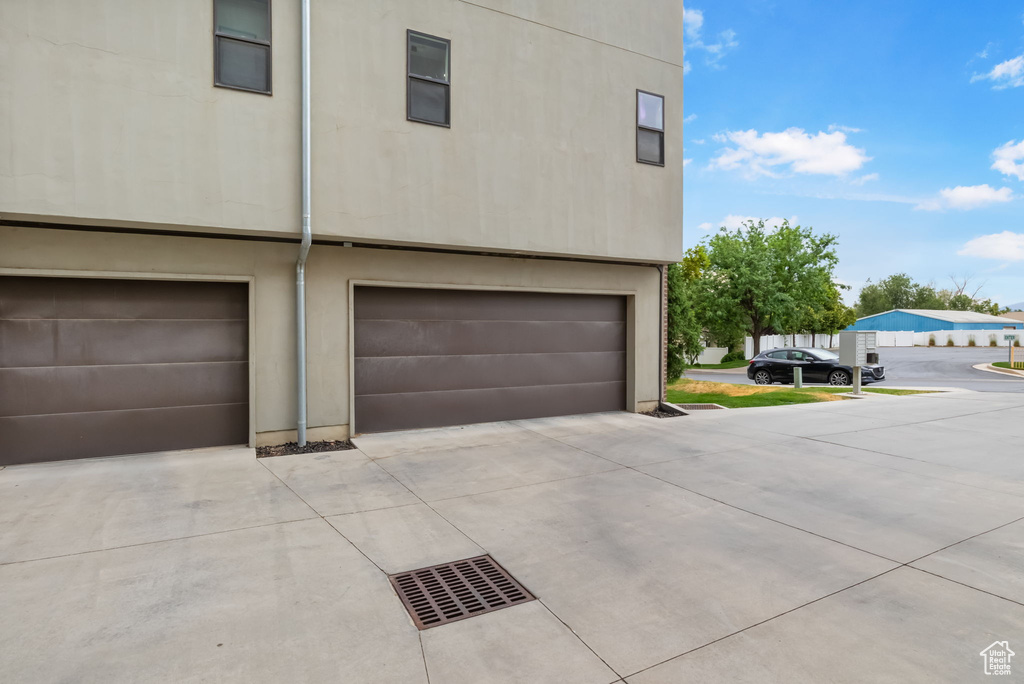 View of home's exterior featuring concrete driveway and an attached garage