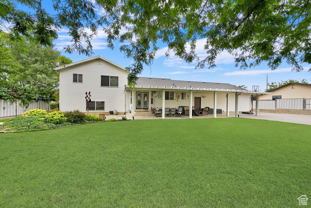 Rear view of property with a patio area