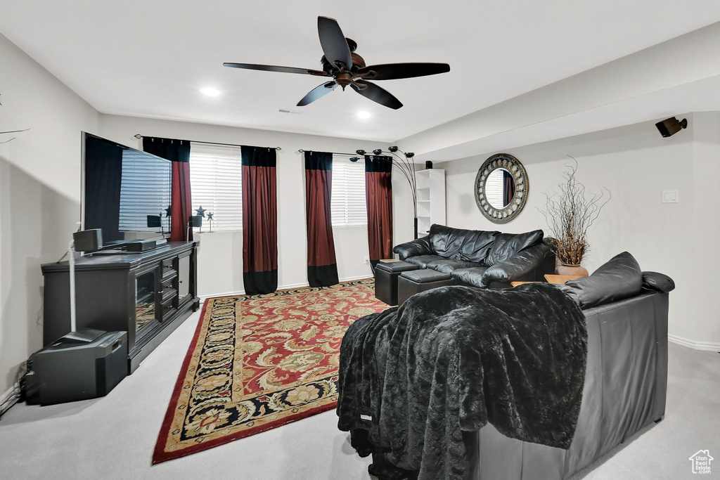 Living room featuring carpet flooring, a ceiling fan, and recessed lighting