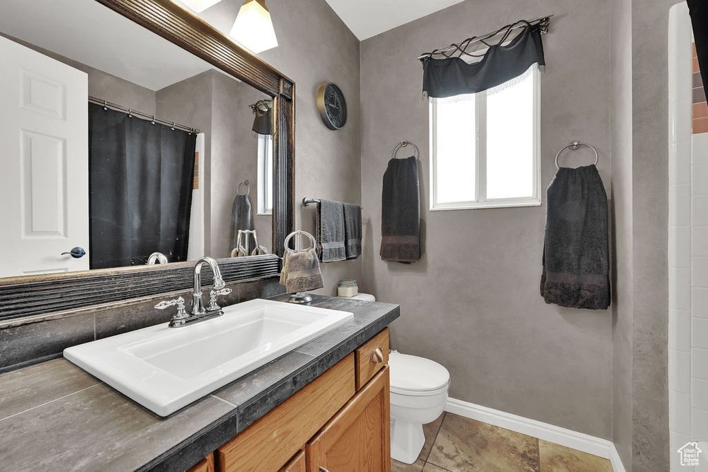 Bathroom with vanity and a shower with curtain