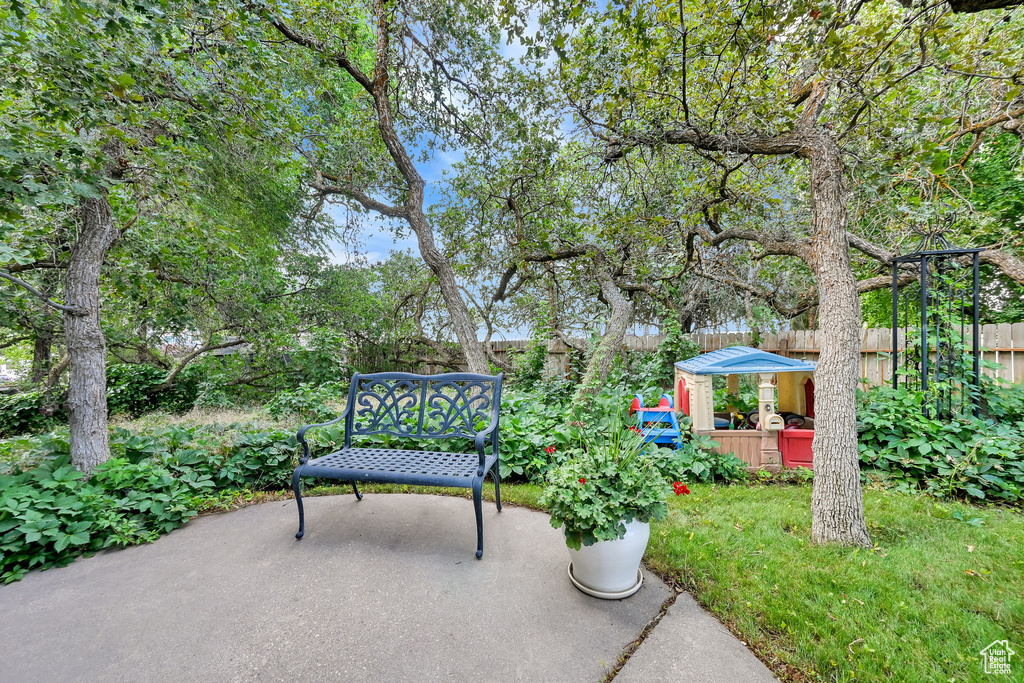 Fenced backyard with a patio