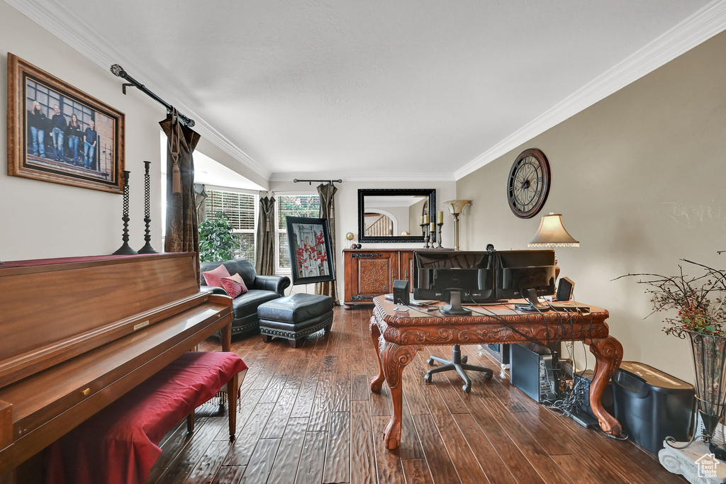 Office area featuring hardwood / wood-style flooring and ornamental molding