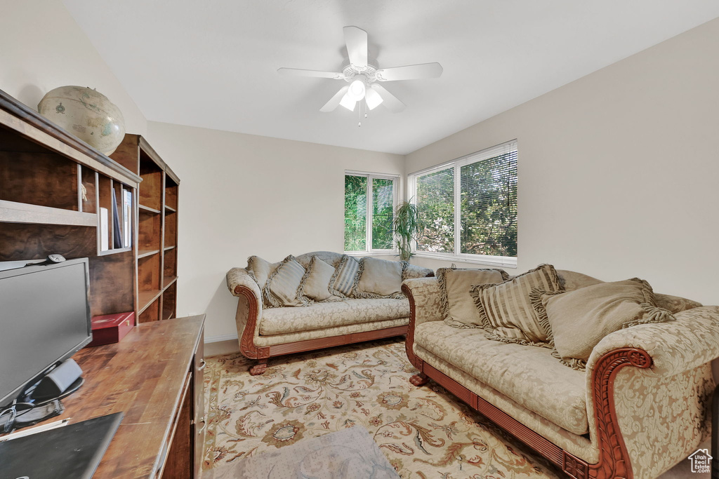 Living area featuring a ceiling fan