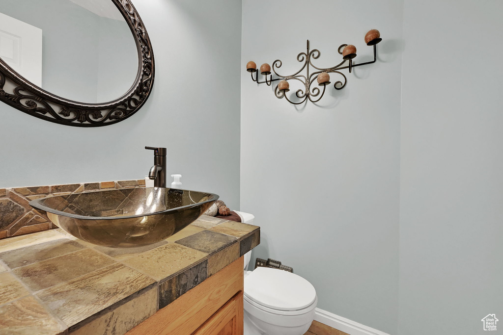 Bathroom featuring vanity and toilet