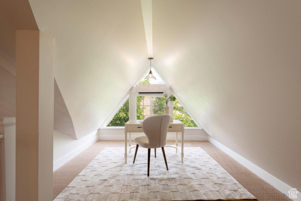 Home office with carpet flooring, lofted ceiling, and a wall mounted AC