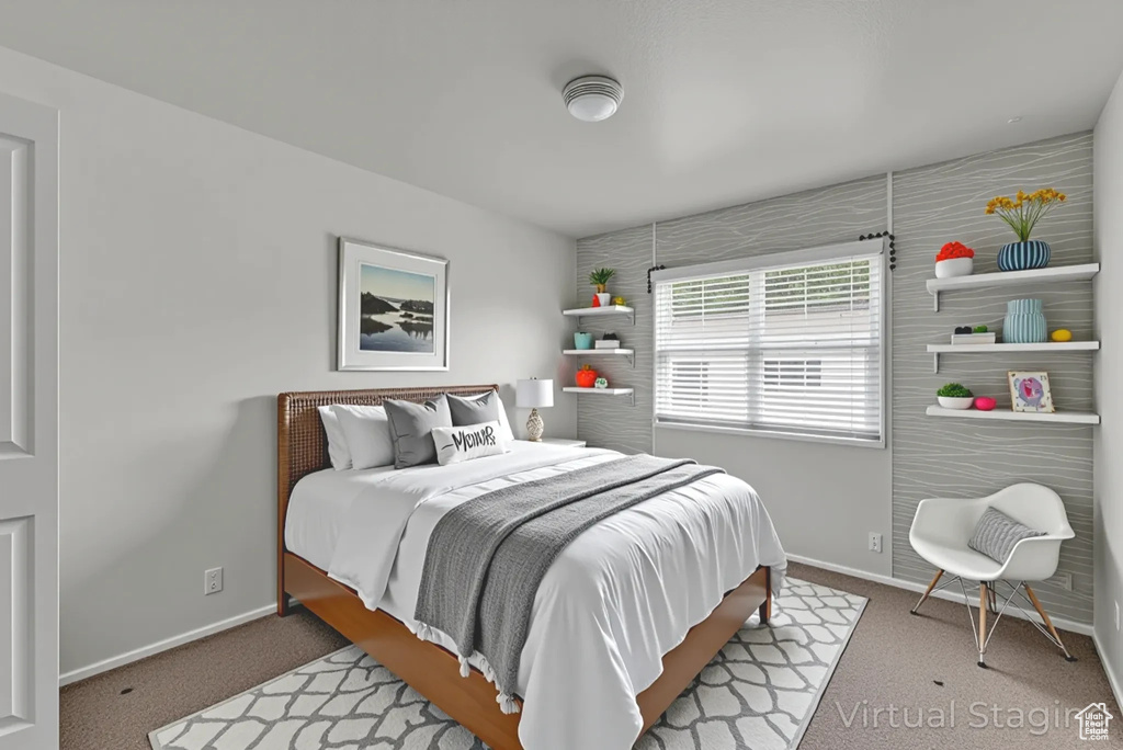 Carpeted bedroom with baseboards