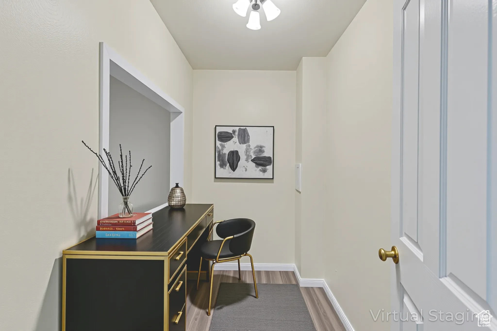 Office space featuring wood finished floors and baseboards