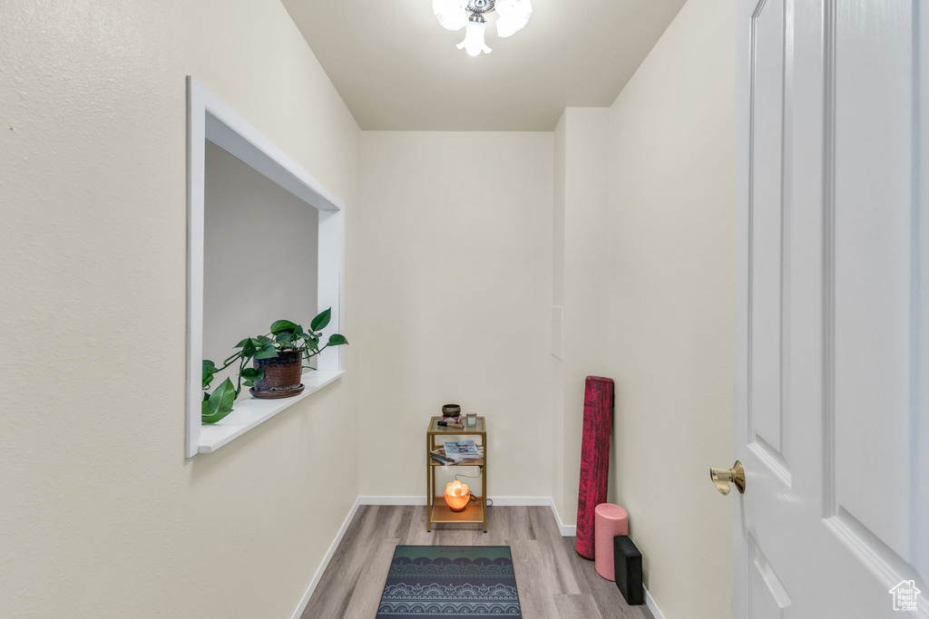 Bathroom with wood finished floors and baseboards