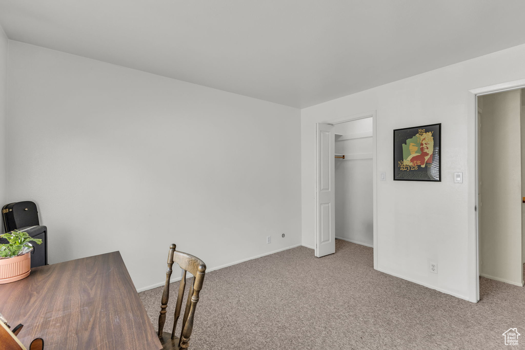 Office with carpet floors and baseboards