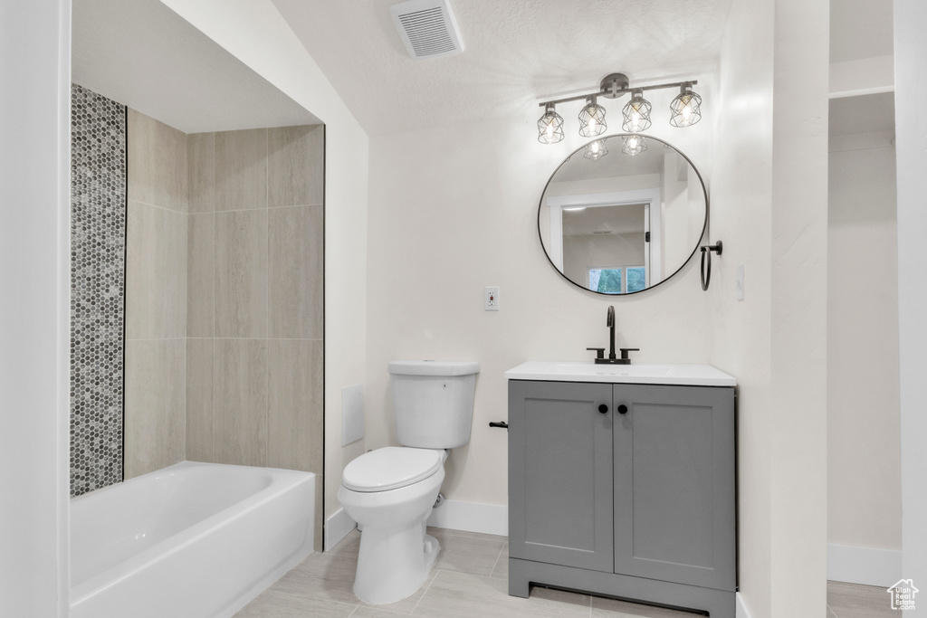 Full bath featuring vanity,  shower combination, and tile patterned flooring