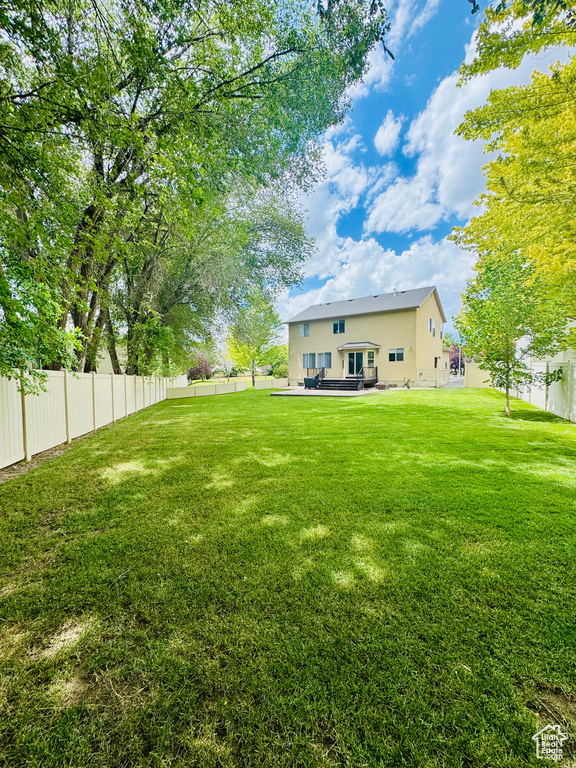 View of fenced backyard