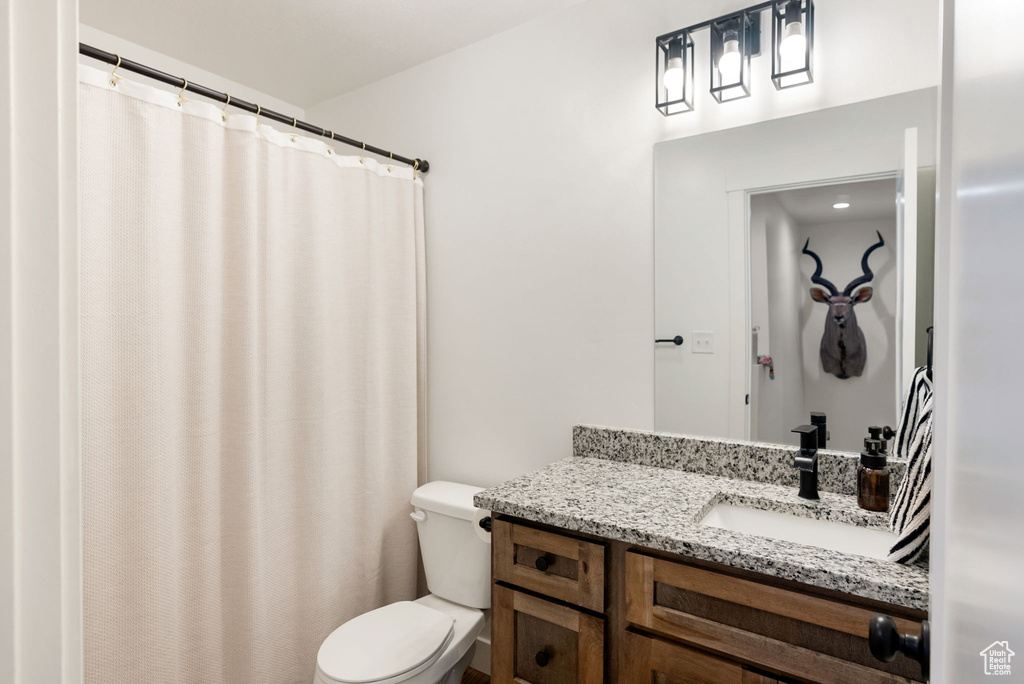 Bathroom with vanity and a shower with curtain