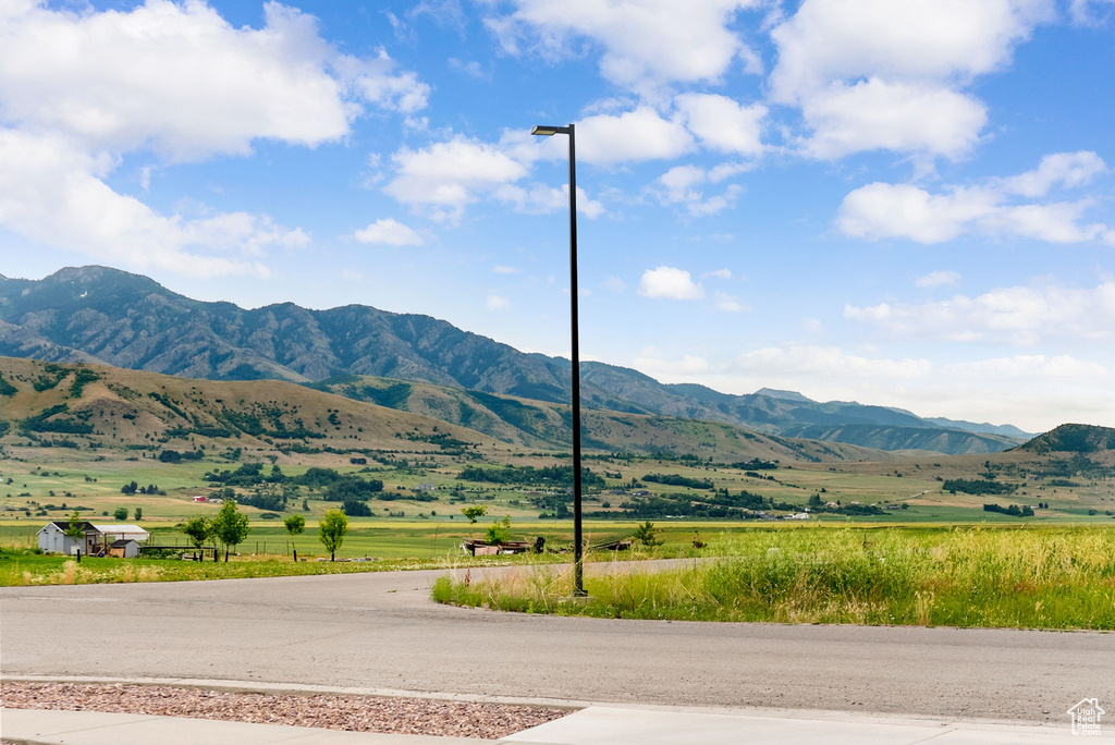 View of mountain background featuring rural landscape