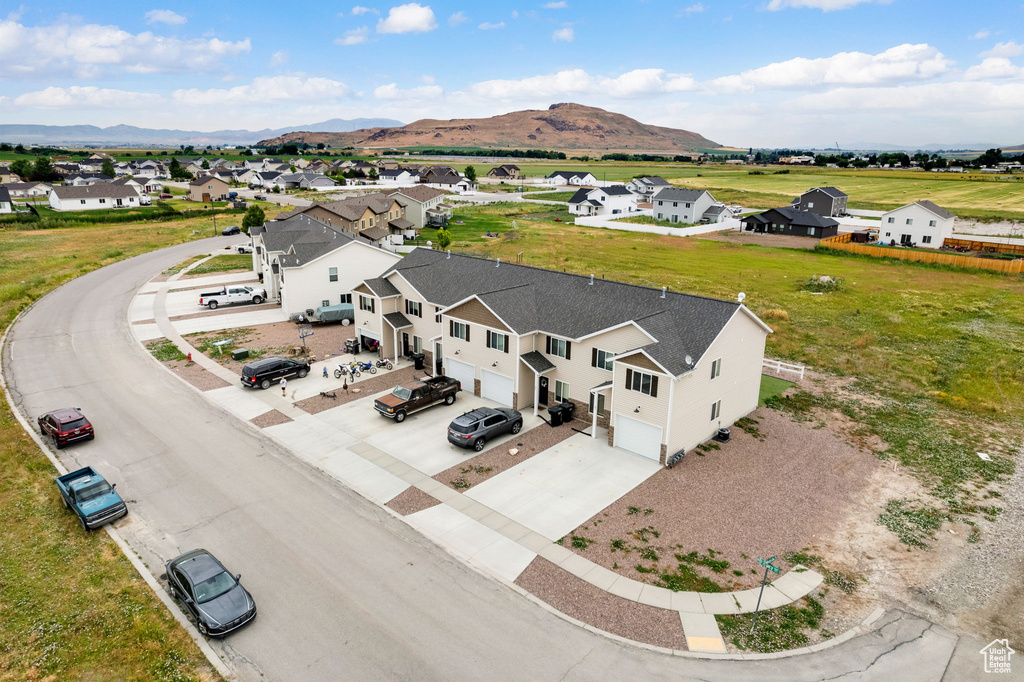 Aerial view of residential area featuring mountains