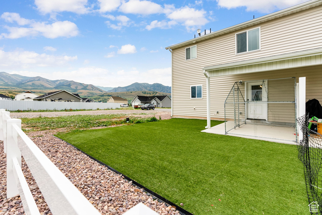 View of yard with a mountain view and a patio area