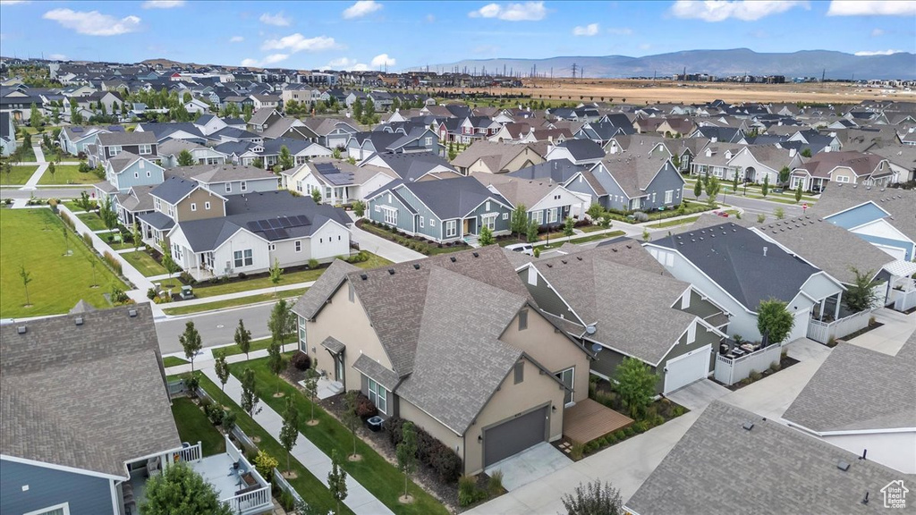 Aerial perspective of suburban area featuring a mountain backdrop