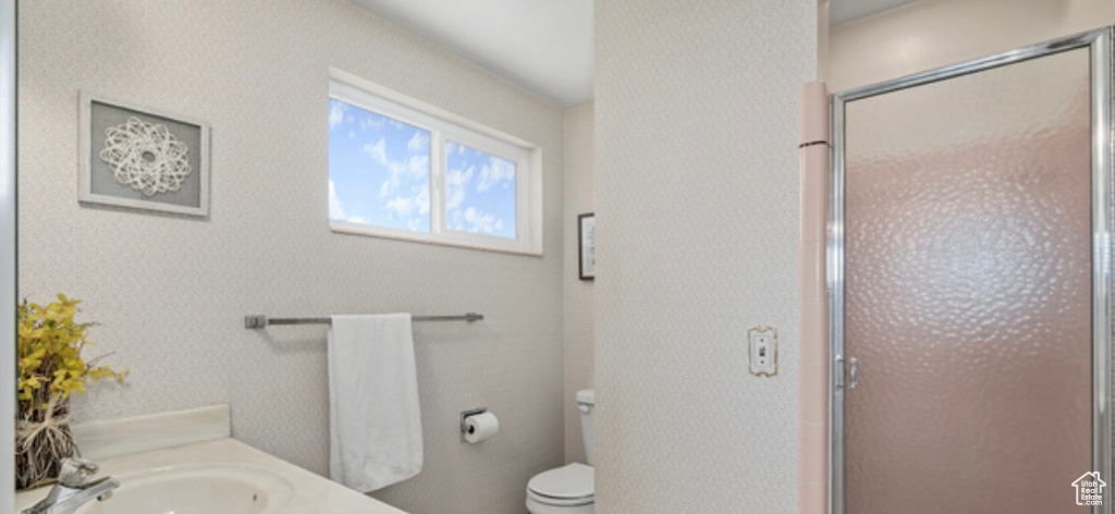 Bathroom featuring vanity and a stall shower