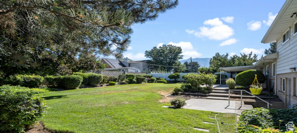 View of yard featuring a patio area and a mountain view