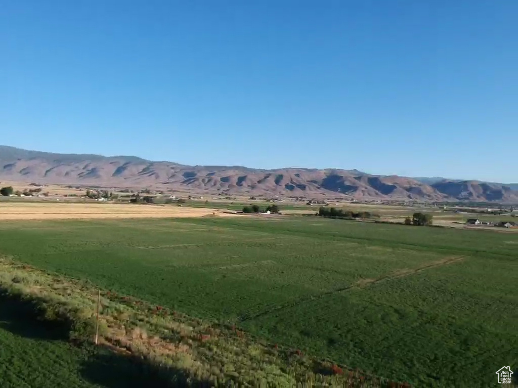 View of mountain background featuring rural landscape