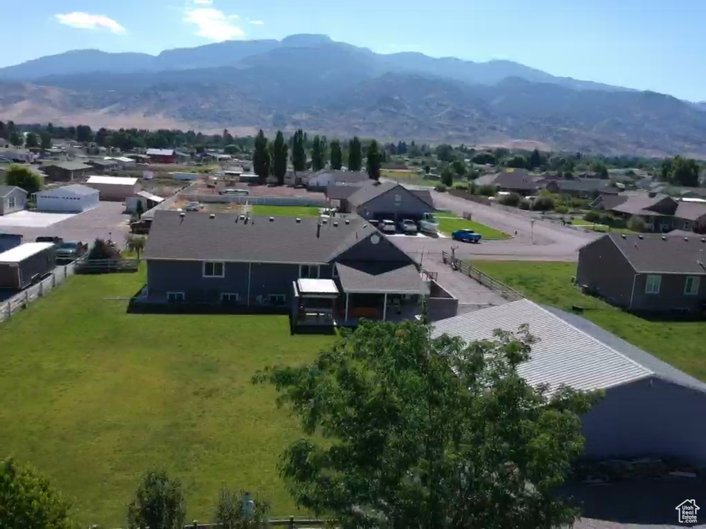 Aerial perspective of suburban area with a mountain backdrop