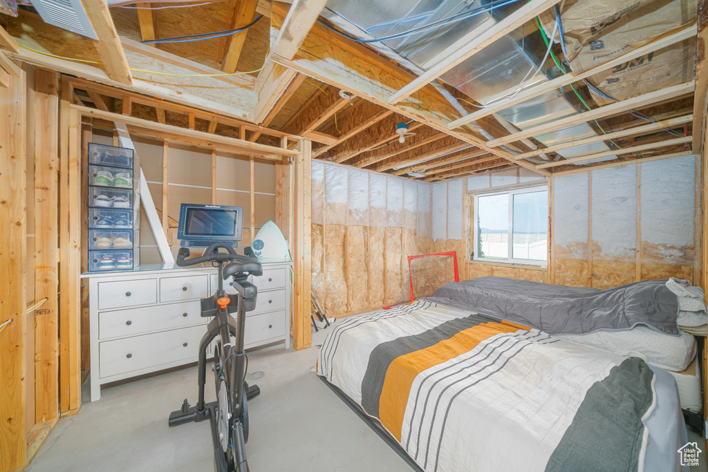 Bedroom with concrete flooring