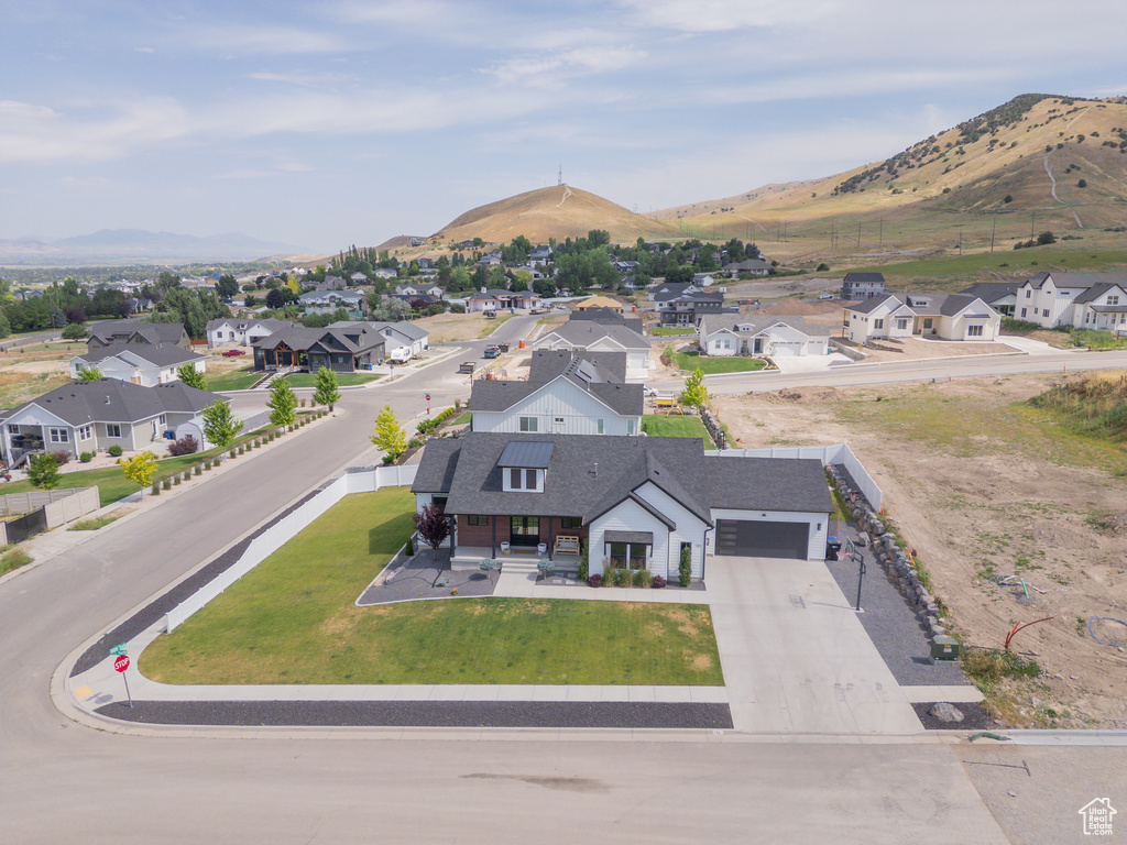 Aerial view of residential area featuring a mountain backdrop