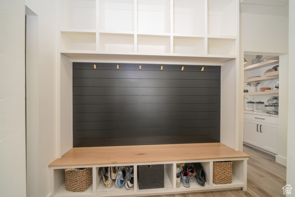 Mudroom featuring light wood-style floors