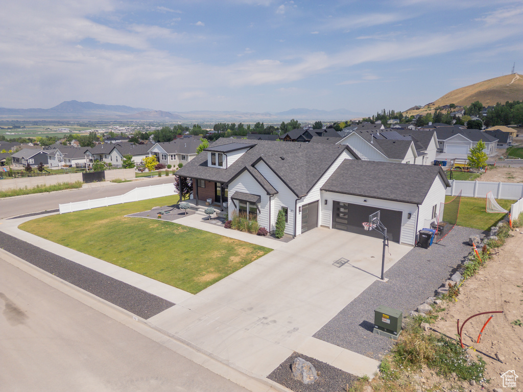 Aerial view of residential area featuring a mountain backdrop