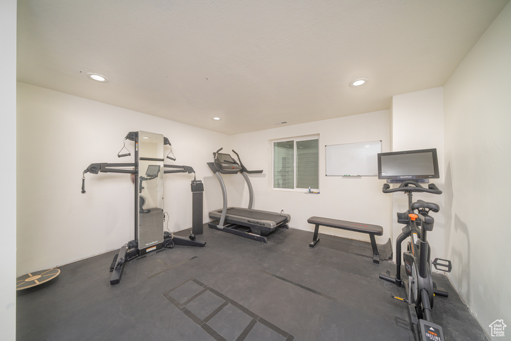 Workout area featuring recessed lighting