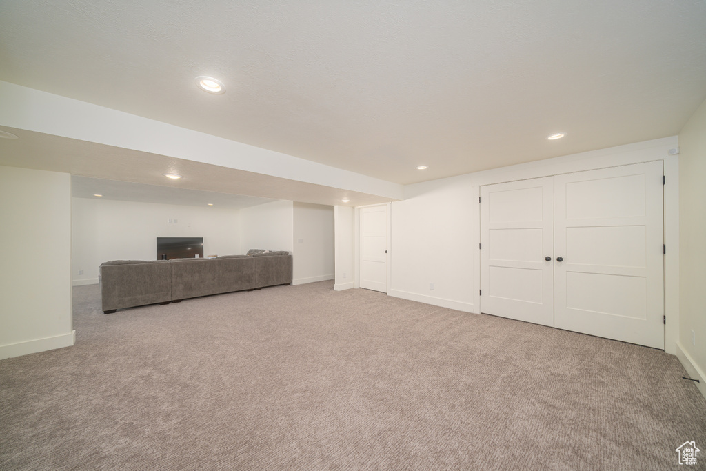 Finished below grade area with carpet floors and recessed lighting