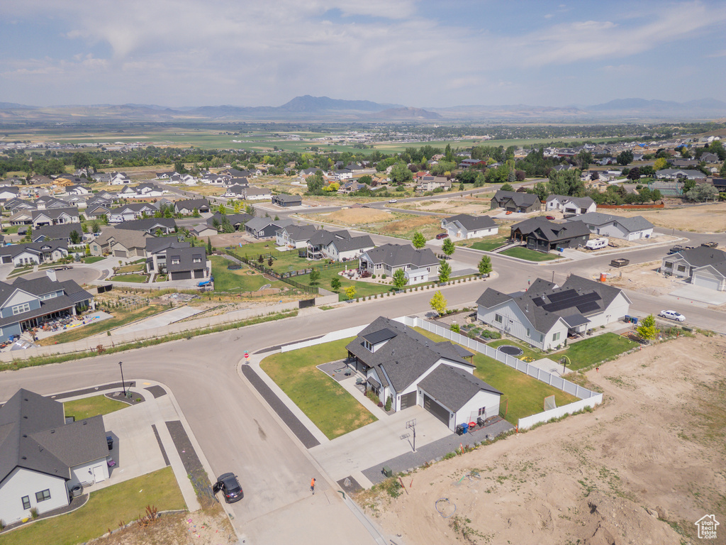 Aerial view of residential area featuring a mountain backdrop