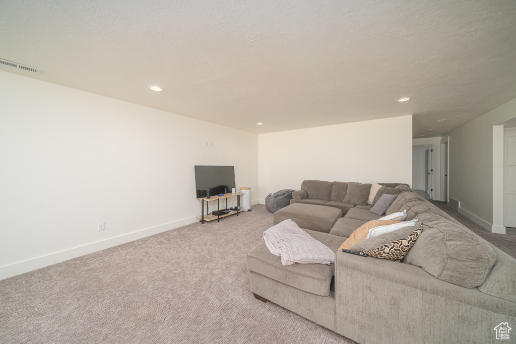 Living room featuring carpet flooring and recessed lighting