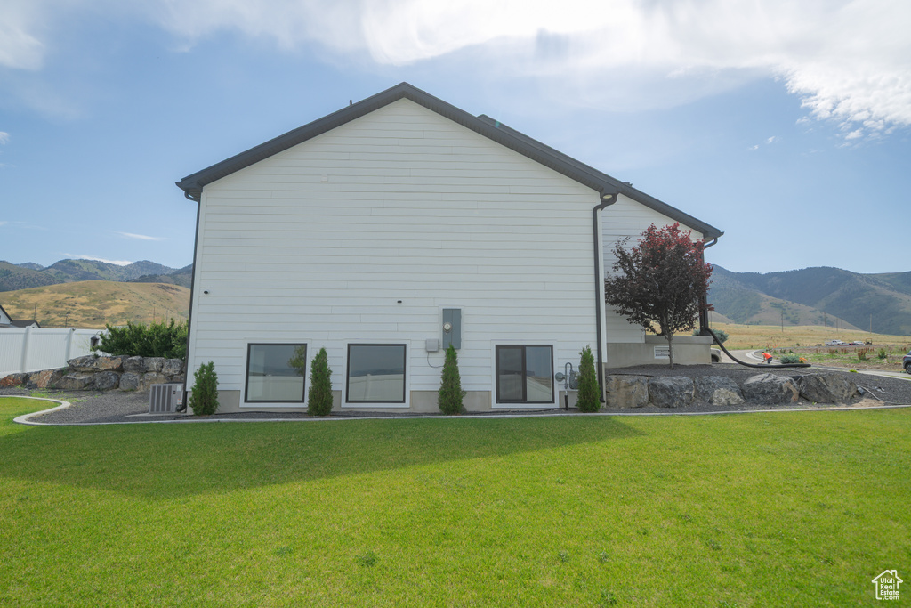 Back of house featuring a mountain view