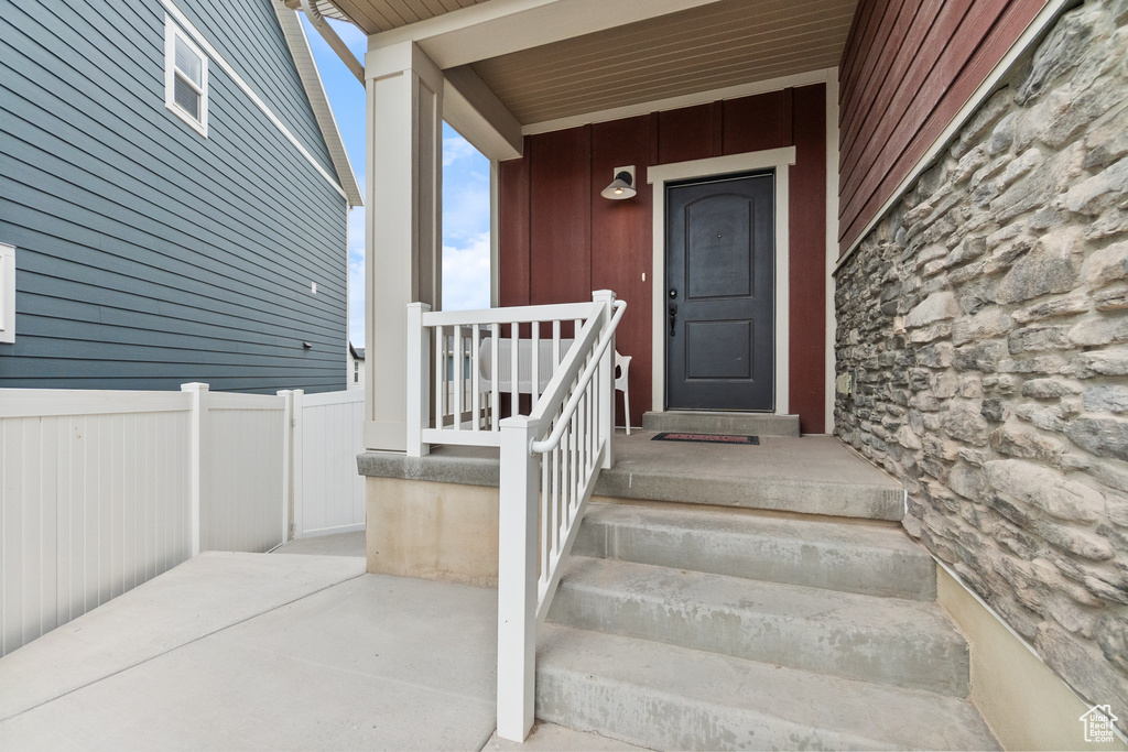 View of exterior entry featuring stone siding