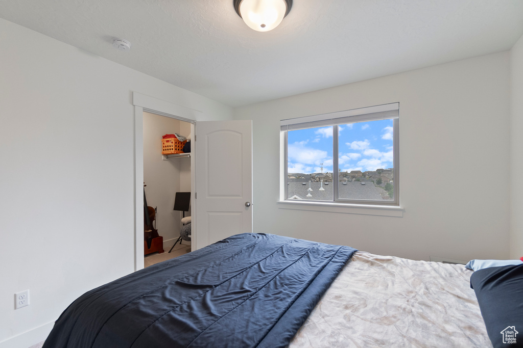 Bedroom featuring baseboards