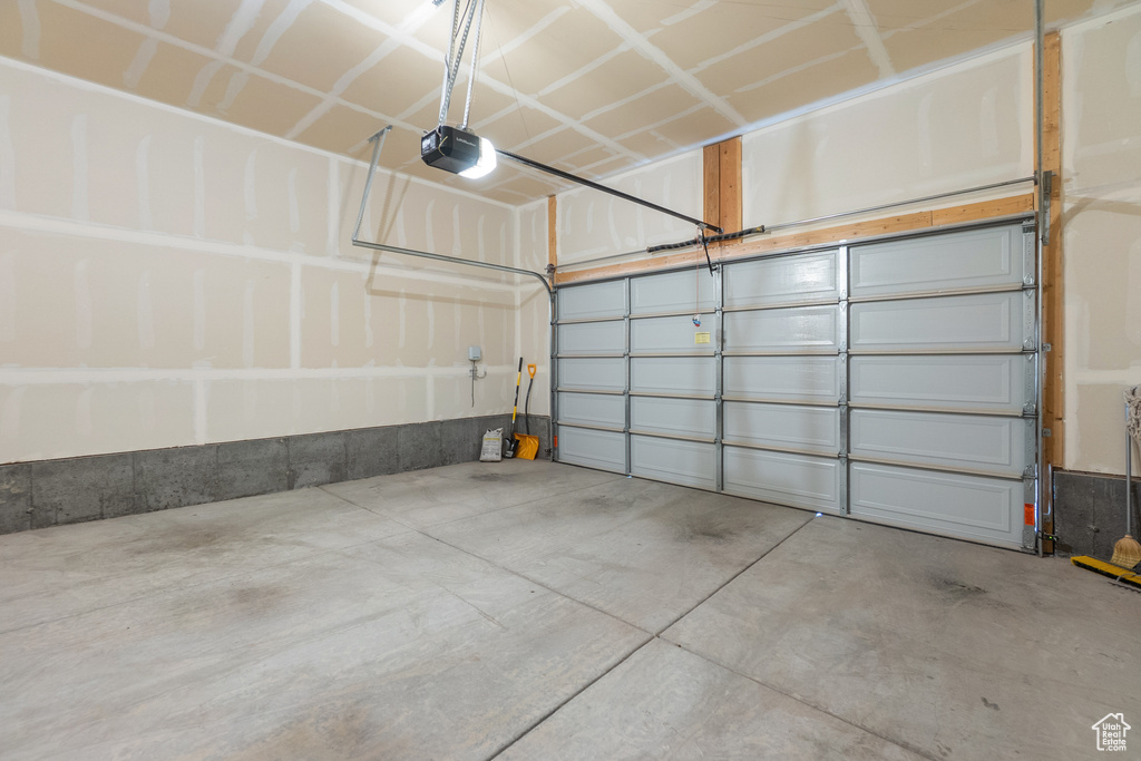 Garage featuring a garage door opener