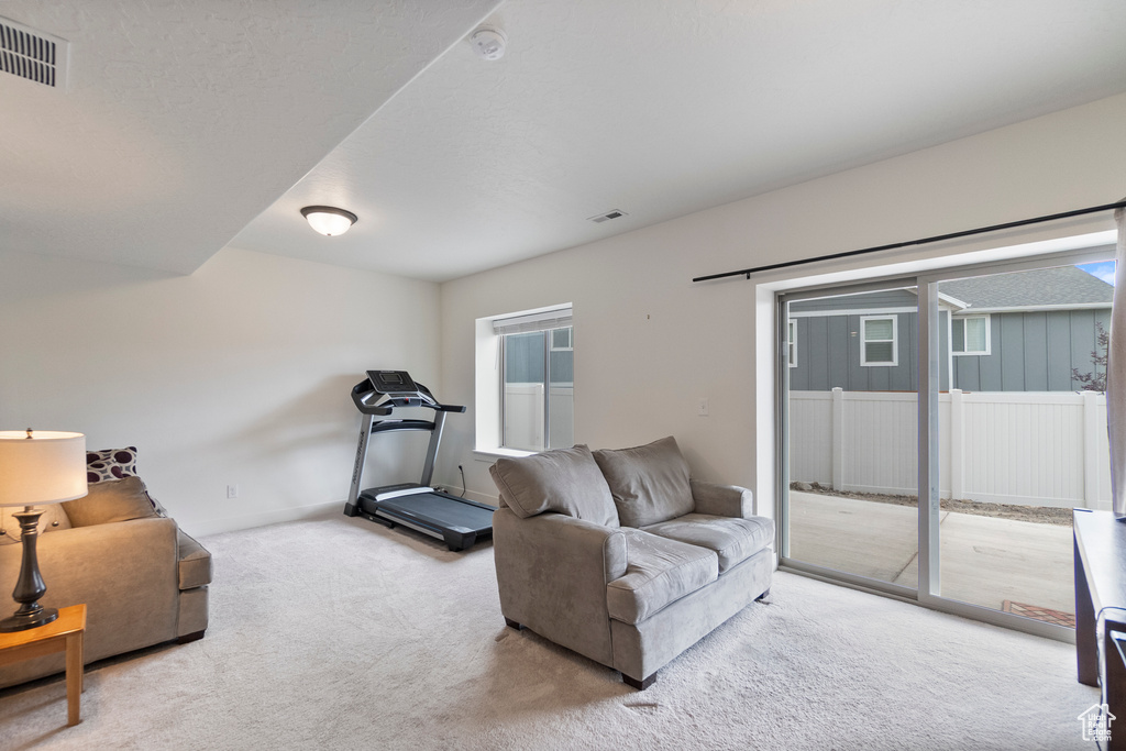 Living room with carpet floors and baseboards