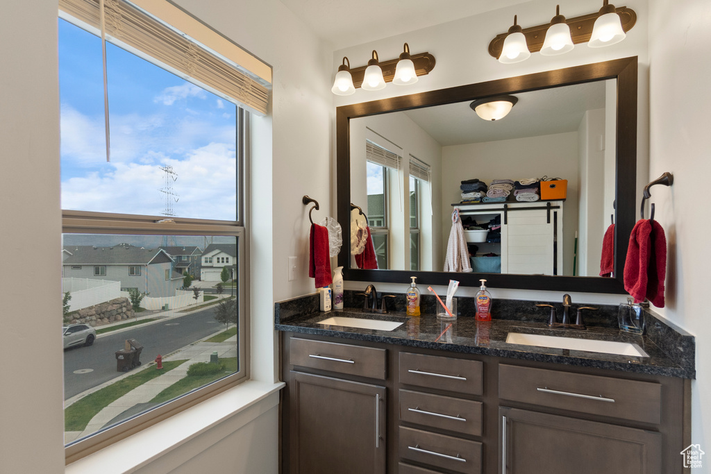 Bathroom featuring double vanity