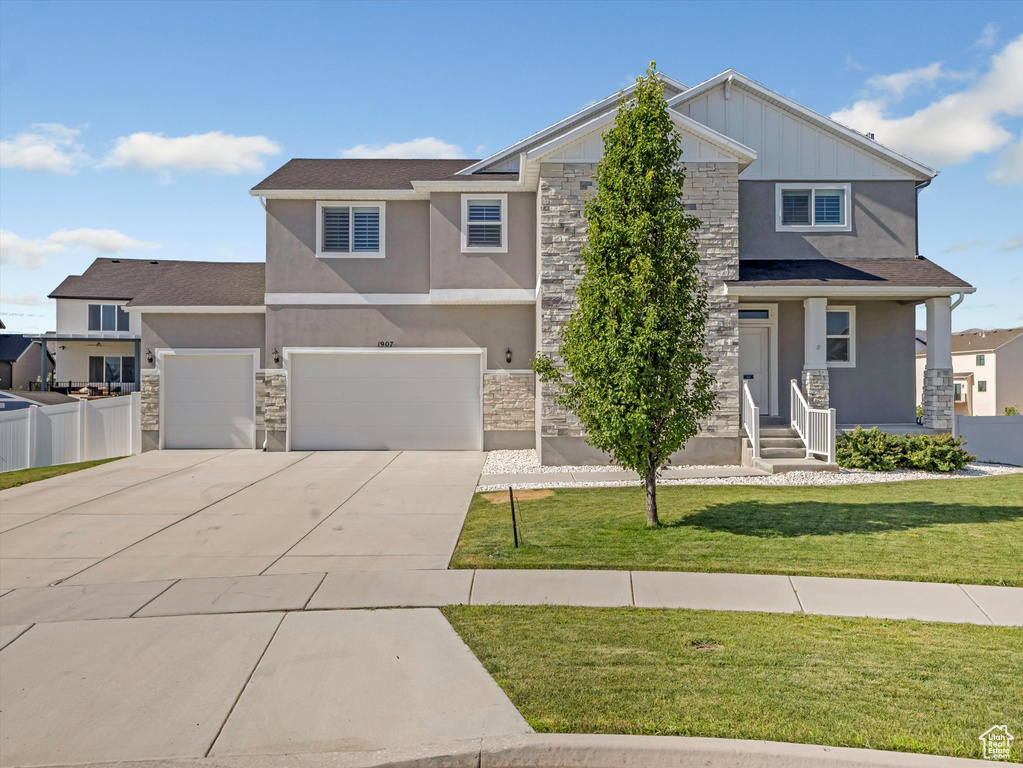 Craftsman inspired home with stone siding, stucco siding, and concrete driveway
